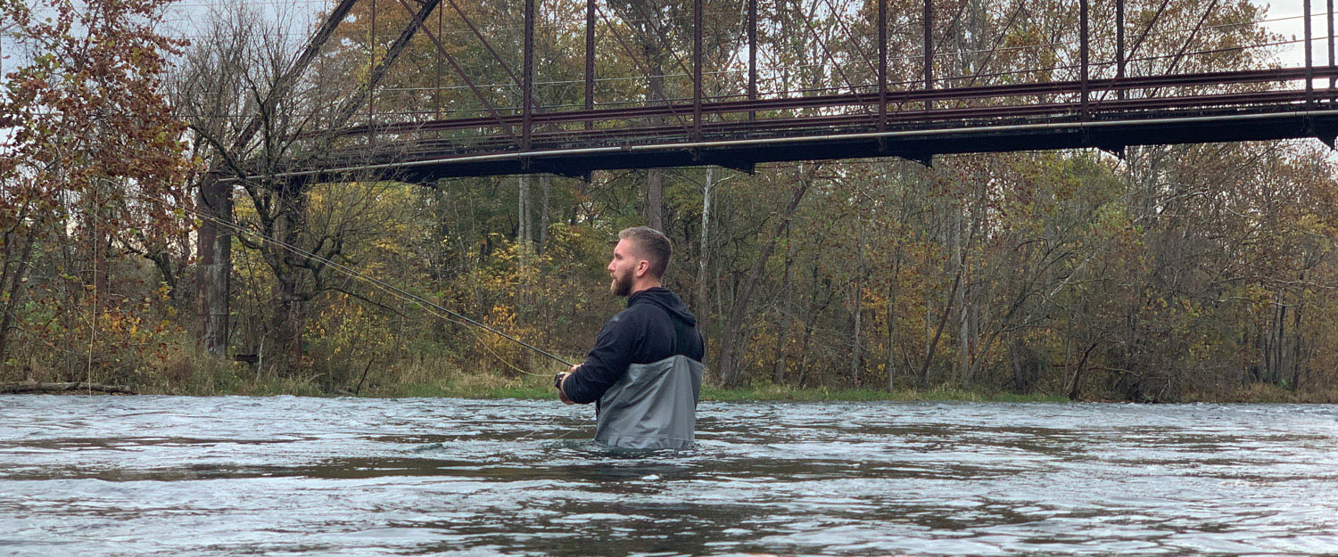 Man wade fishing photo